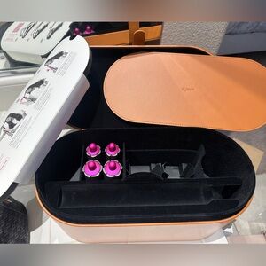Dyson tan storage case and curling barrels